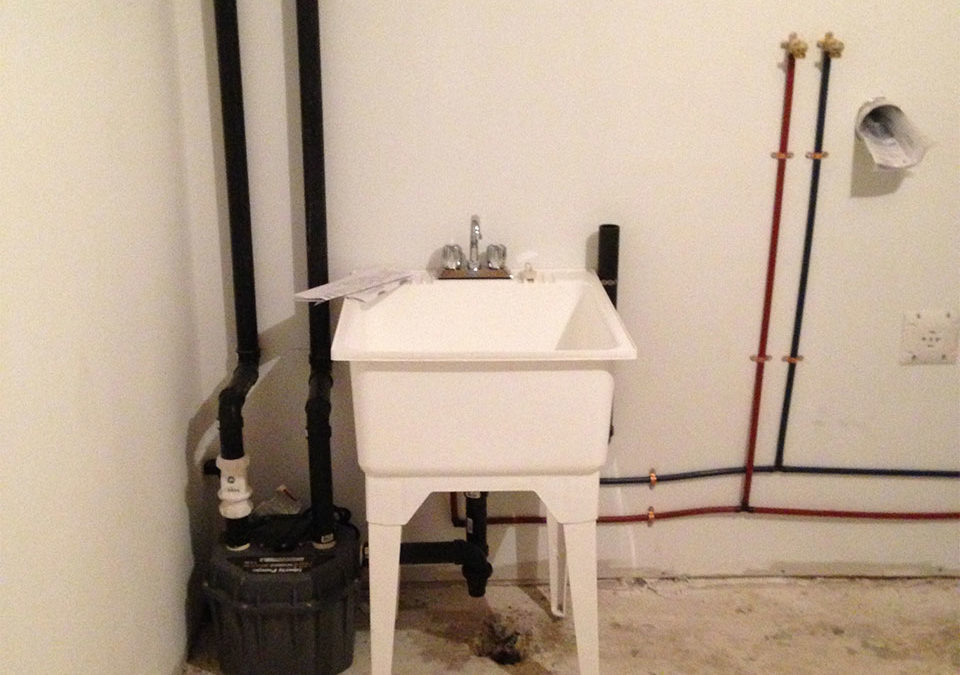 newly installed plumbing and laundry sink