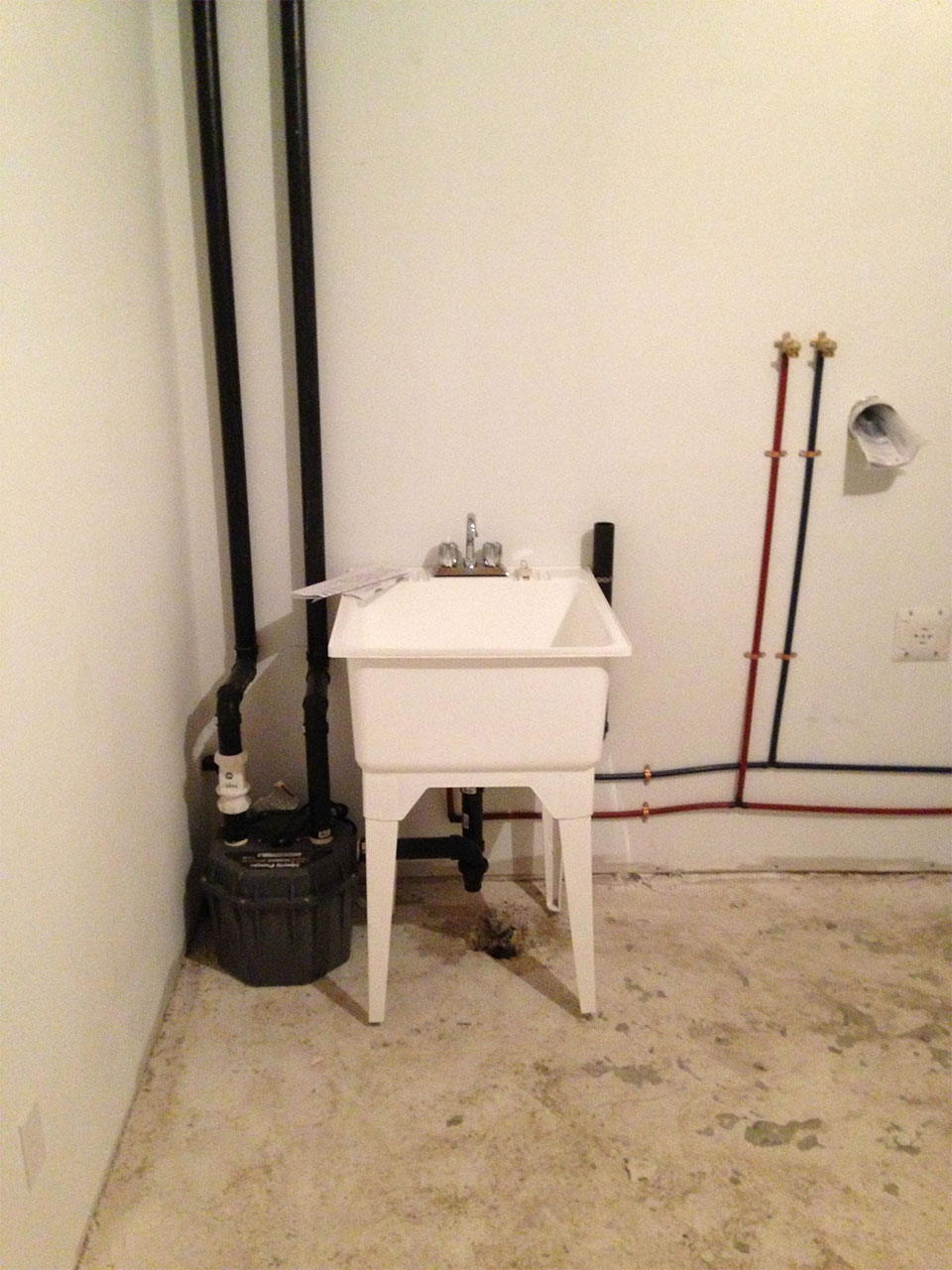 newly installed plumbing and laundry sink