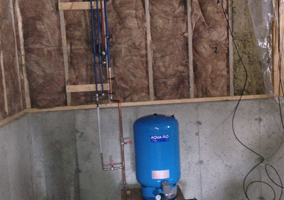 newly installed plumbing with water pressure tank