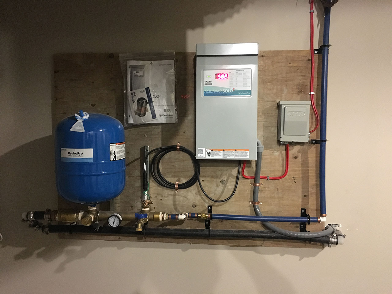 newly installed well/submersible pump controls with pressure tank